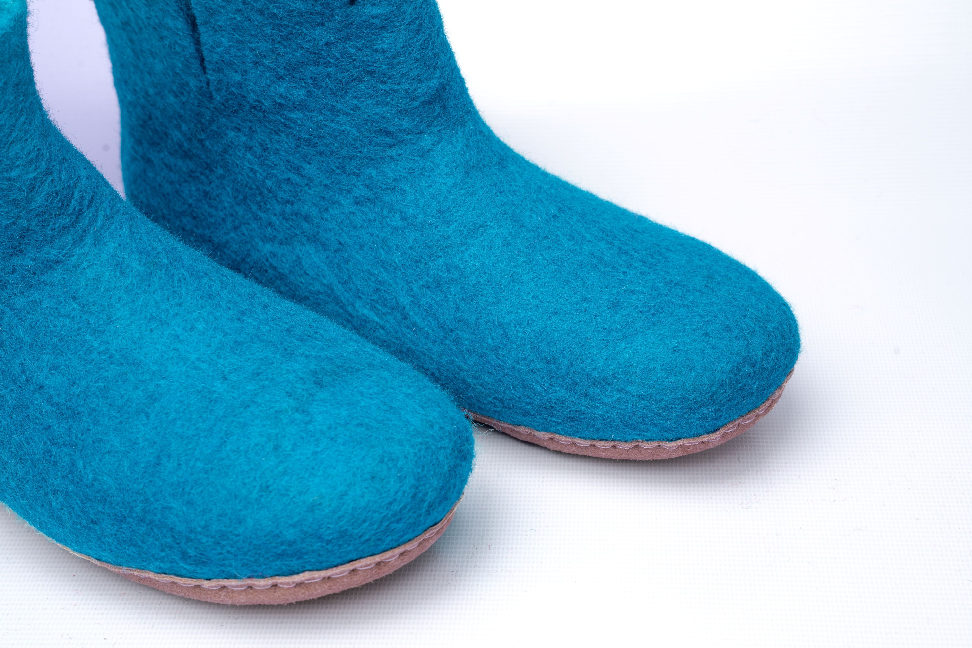 Woollyes Hausschuhe mit Ledersohle – Türkis